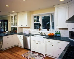 Kitchen with a large window in the middle design