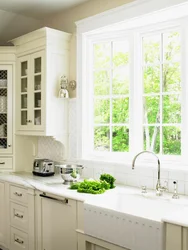 Kitchen with a large window in the middle design