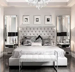 Bedroom with mirrors on the sides photo