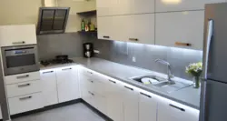 White Kitchen With Gray Countertop And Apron In The Interior Photo