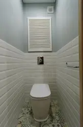 Toilet design in a small apartment with panels