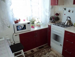 Refrigerator design under the window in the kitchen in Khrushchev photo