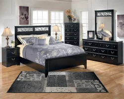 Black bed in the bedroom interior photo