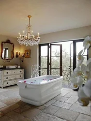 Photo of a bathroom with a bathtub in the middle