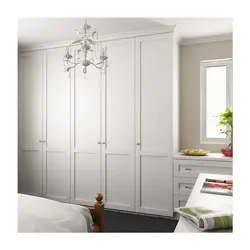 White wardrobe in bedroom interior