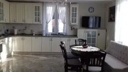 In the kitchen there are 2 windows on different walls photo