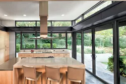 Kitchen design with panoramic windows in a modern style