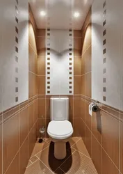 Photo of a toilet in an apartment tile design