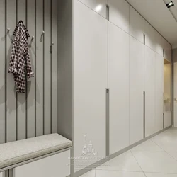Hallway design with a wardrobe in light colors