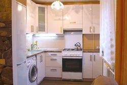 Kitchen Design In An Apartment With A Gas Stove And Refrigerator
