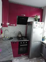 Kitchen design in an apartment with a gas stove and refrigerator