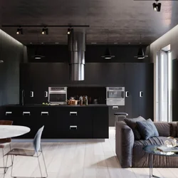 Photo of a dark living room with kitchen