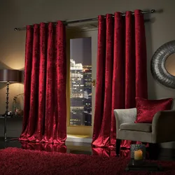 Velvet curtains in the interior of a living room in style