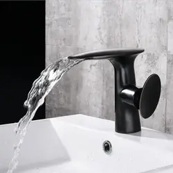 Bathroom with black faucets photo