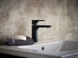 Bathroom with black faucets photo