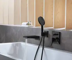 Bathroom With Black Faucets Photo