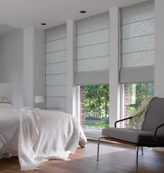Roman blinds in a modern bedroom interior