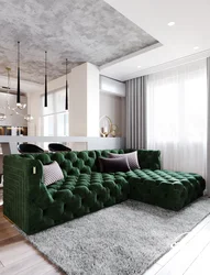 Green sofa in the living room interior and photo curtains in the interior
