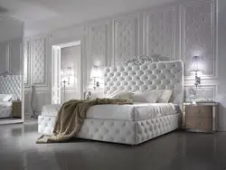 Bedroom design with a bed with a soft headboard