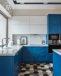 Photo of small blue kitchen
