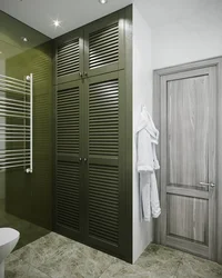 Louvered doors in the bathroom interior