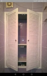 Louvered Doors In The Bathroom Interior