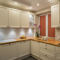 Beige kitchen with light countertop photo