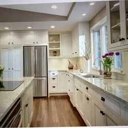 Beige kitchen with light countertop photo