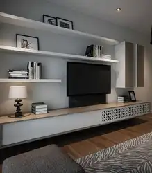 Shelves above the TV in the living room in the interior