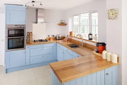 White kitchen and wooden table photo