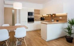 White kitchen and wooden table photo