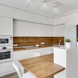 White Kitchen And Wooden Table Photo