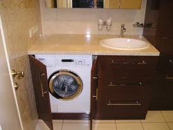Built-in washing machine in the bathroom photo