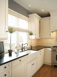 Photo of a kitchen with a window in light colors