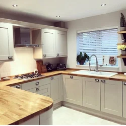 Kitchens in a modern style with a wooden countertop photo
