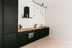 Photo of a kitchen without upper cabinets in style