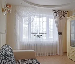 Curtains for two windows with a wall photo in a modern living room