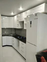 Corner white kitchen in the interior photo