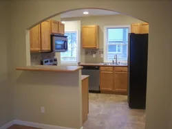 Arches between the kitchen and living room photo only