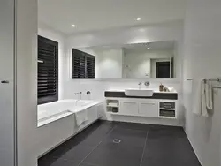 Bath design dark floor light walls