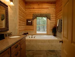 Bathroom design in a wooden house with tiles