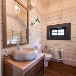 Photo of a bathroom in a wooden house