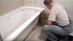 Attaching The Screen To The Bathtub Photo