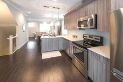 White kitchen dark floor design