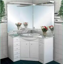 Bathroom sink with cabinet and mirror photo