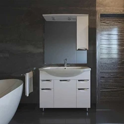 Bathroom Sink With Cabinet And Mirror Photo