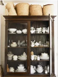 How to arrange dishes in a living room sideboard photo