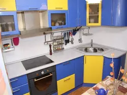 Yellow-blue kitchen in the interior photo