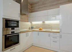 White kitchen with wooden countertops, real photos