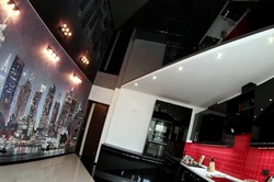 Black glossy stretch ceiling in the kitchen photo